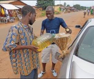 Most motorists in Benin buy their fuel on the black market at roadside stands like this one in Bohicon, in the southern part of the country.