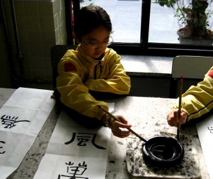 A student at the brand-new Huijia Private School in Beijing practices calligraphy.