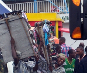 Young men sell a variety of products on the streets of Arusha.