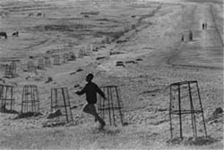 An Eritrean child runs through a field