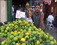 Photo: A vendor sells fruit.