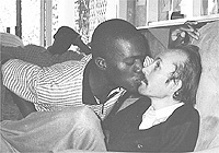 A member of GLAZ kisses Goddard